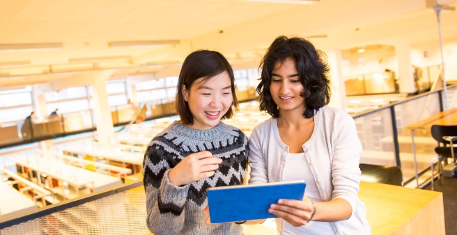 two students in the reading area